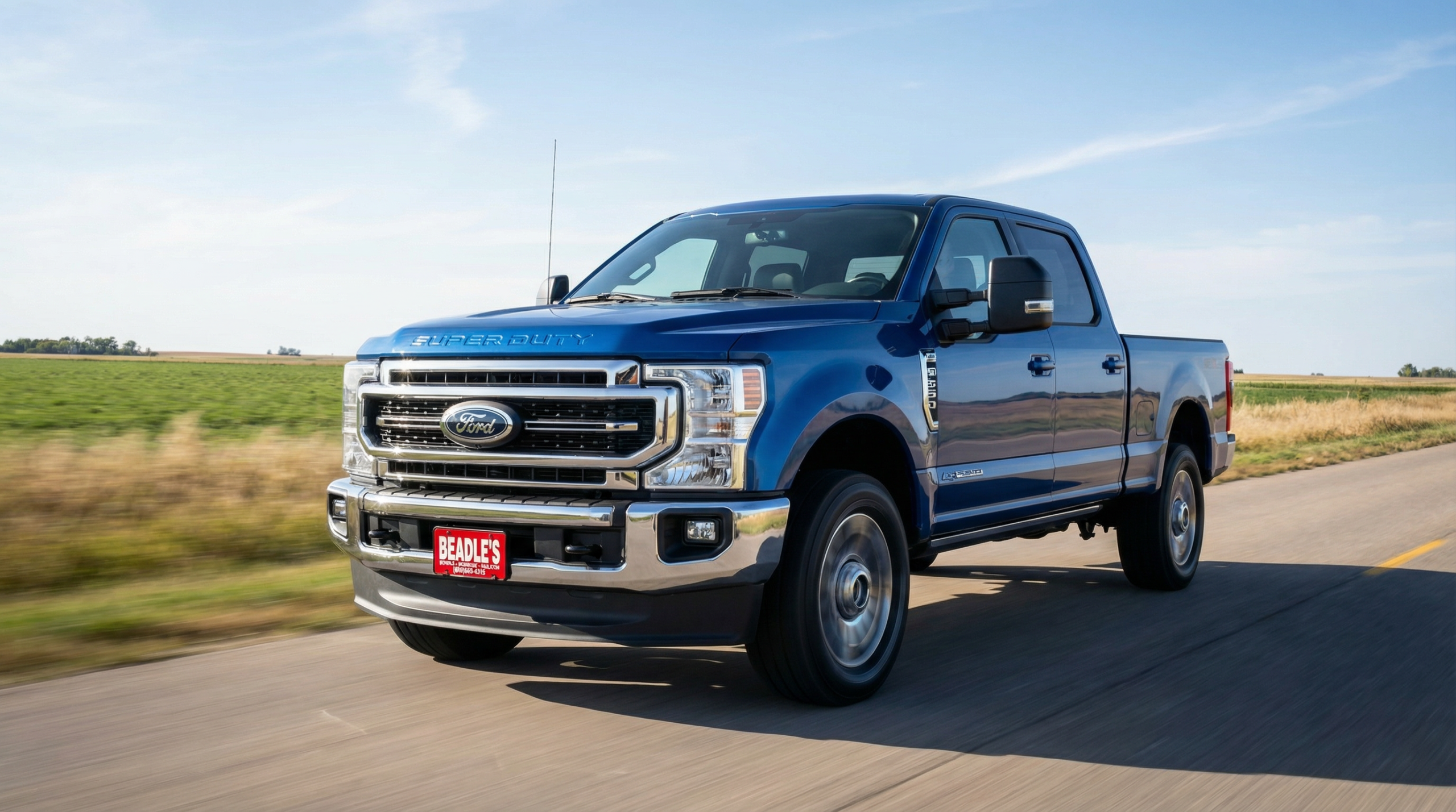 2026 Ford F-350 Super Duty driving on a rural road
