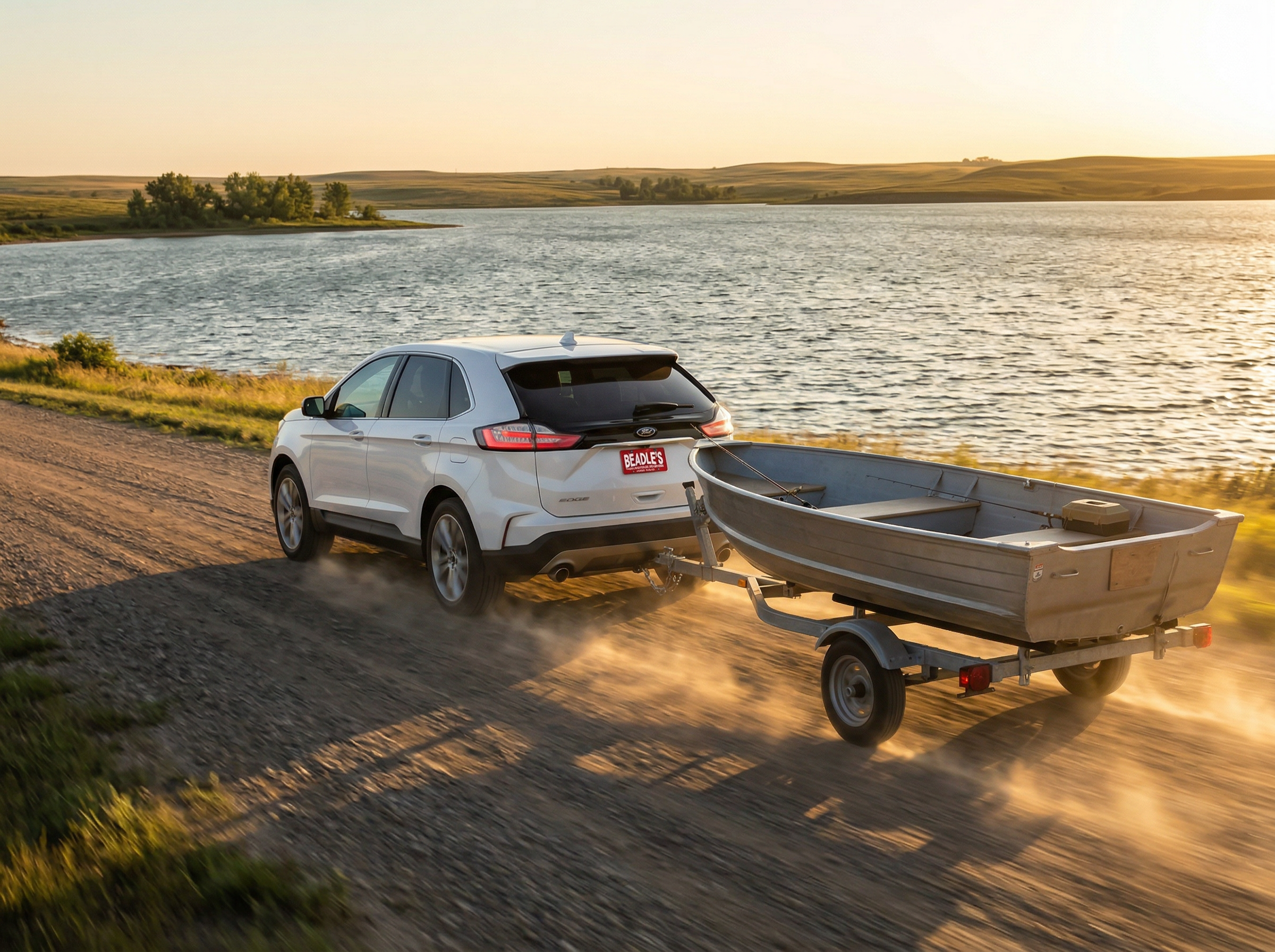 Ford Edge towing boat trailer at Lake Oahe