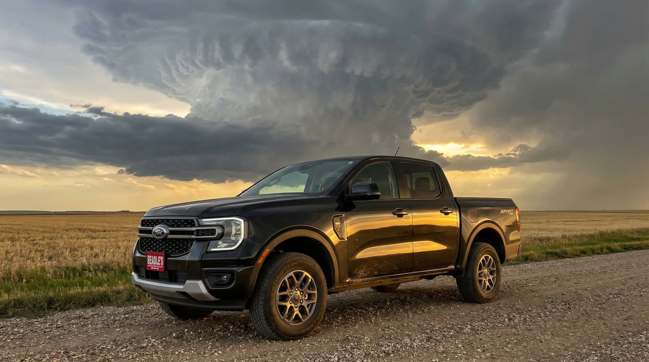 2026 Ford Ranger XLT in Shadow Black under dramatic South Dakota thunderstorm clouds