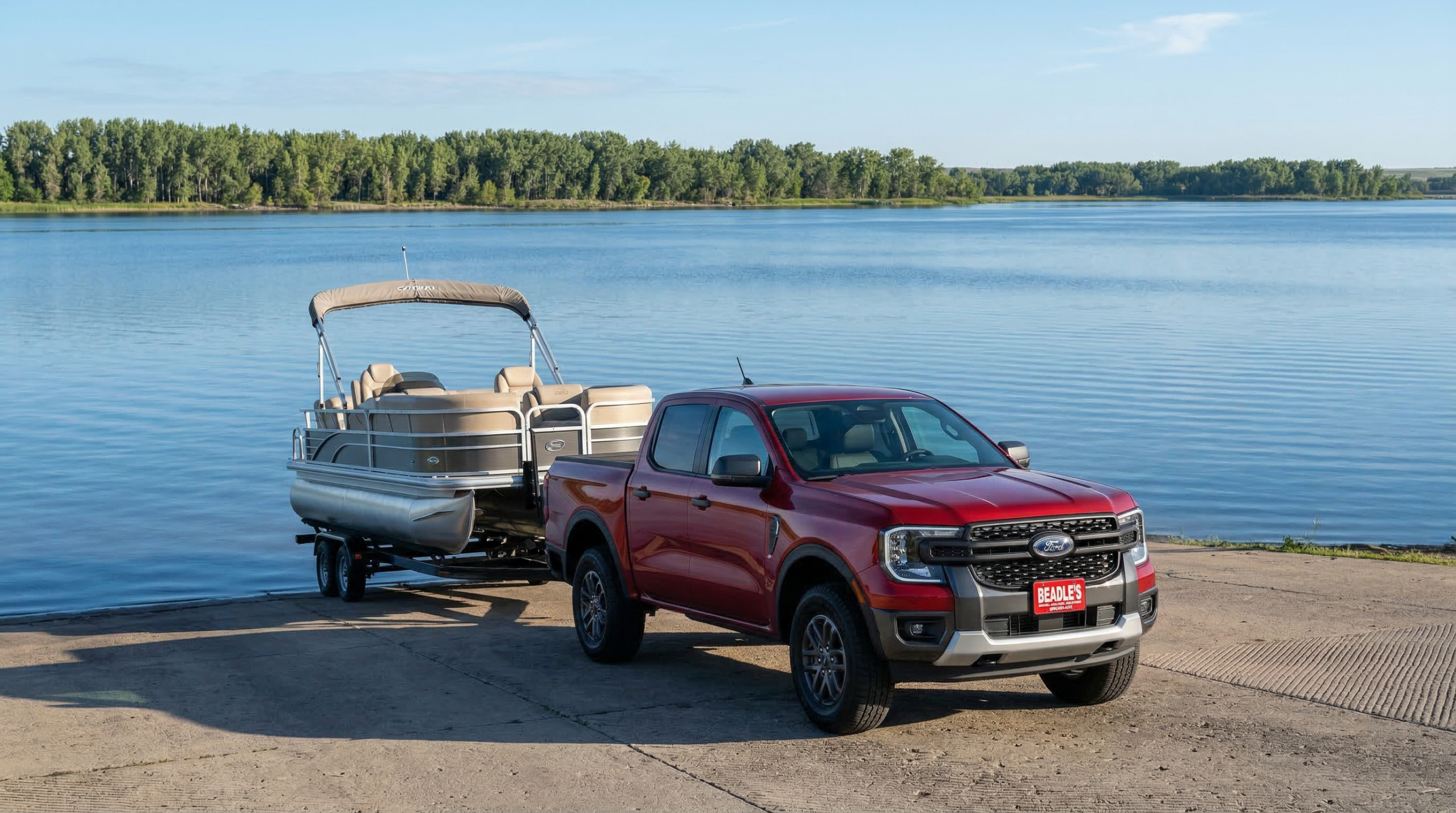 2026 Ford Ranger XLT towing a pontoon boat at the Lake Oahe boat ramp in South Dakota