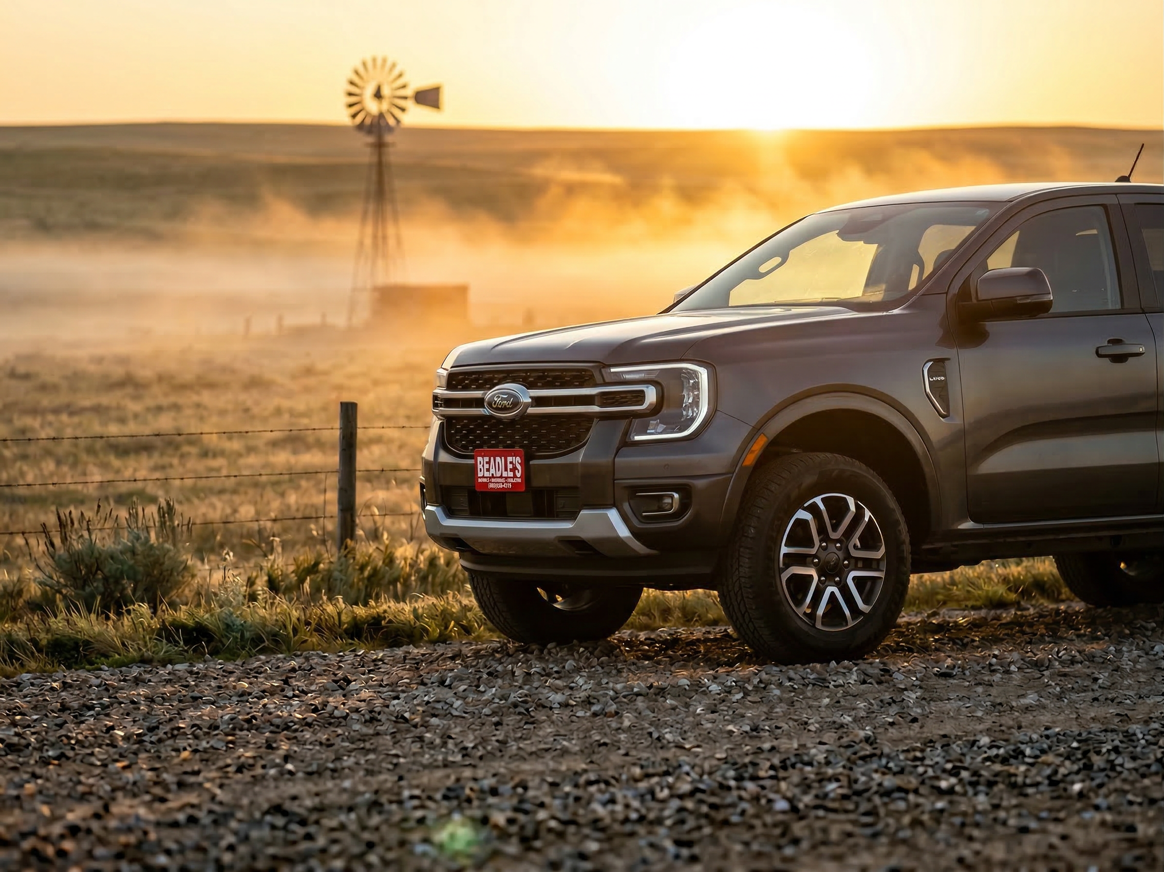 2026 Ford Ranger Lariat on foggy South Dakota prairie ranch road at sunrise