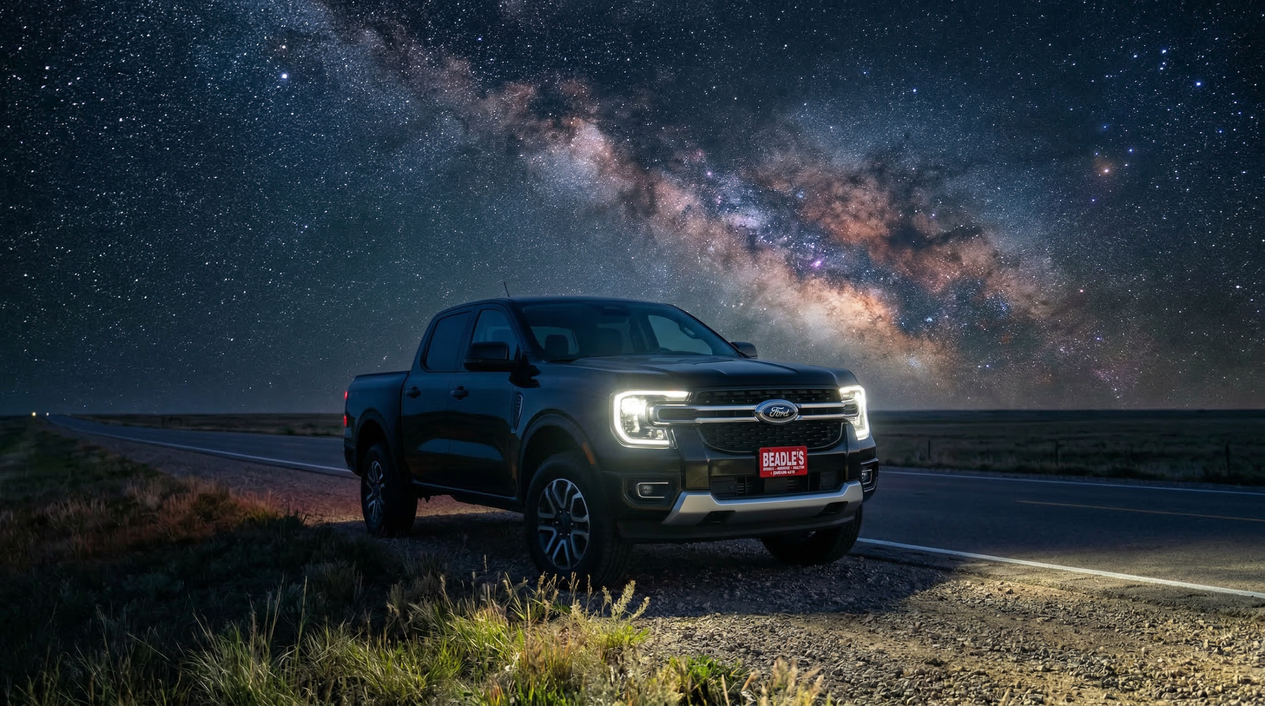 2026 Ford Ranger FX4 parked on a South Dakota prairie highway under the Milky Way
